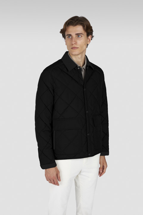 Chaqueta acolchada en tejido técnico con detalles en Alcantara®