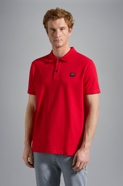 Polo en coton organique piqu&eacute; avec badge iconique