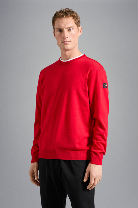 Pull ras du cou en laine Mérinos avec badge iconique Pull ras du cou en laine Mérinos avec badge iconique