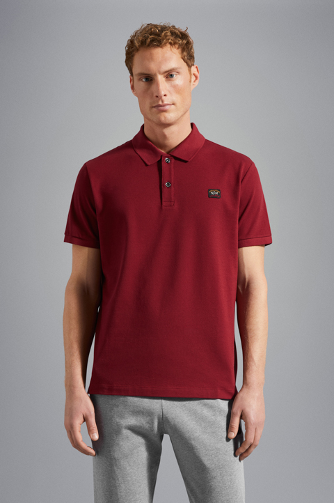 Polo en coton piqu&eacute; avec badge iconique
